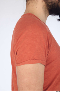 Turgen casual dressed orange t-shirt shoulder upper body 0002.jpg